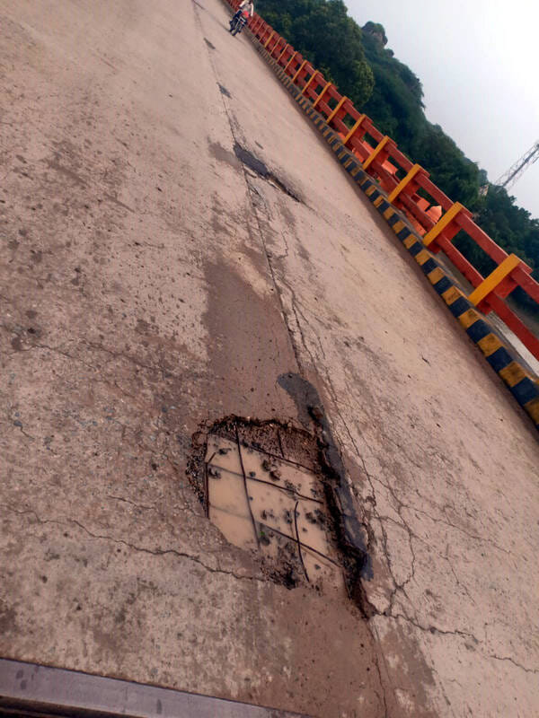 Cement peels off Kachauraghat Bridge; reinforcement bars become visible.