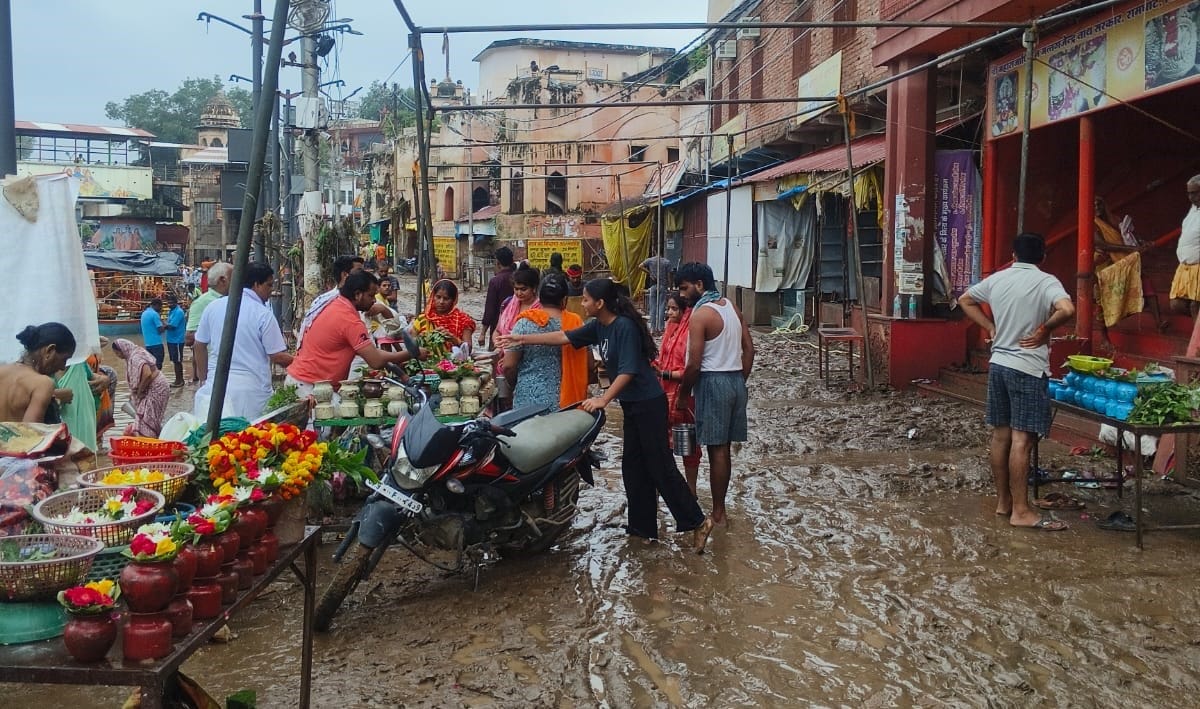 Mandakini's floodwaters receded; pilgrims grappled with the mud.