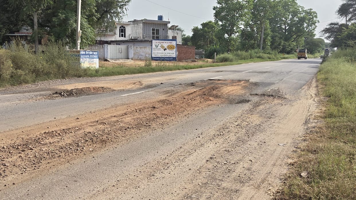 A pothole on the road became a source of trouble for pedestrians and motorists