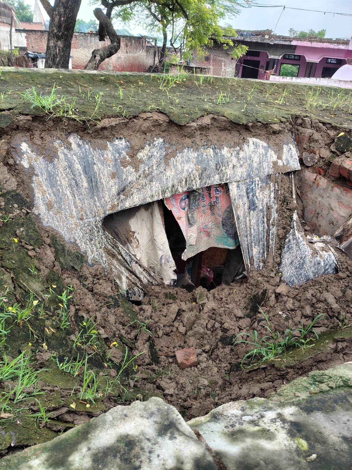 The roof of the laborer's house collapsed, burying his belongings.