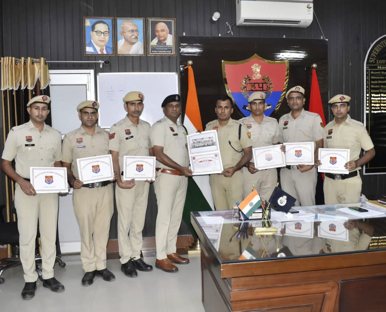 Police personnel encouraged by being presented with certificates
