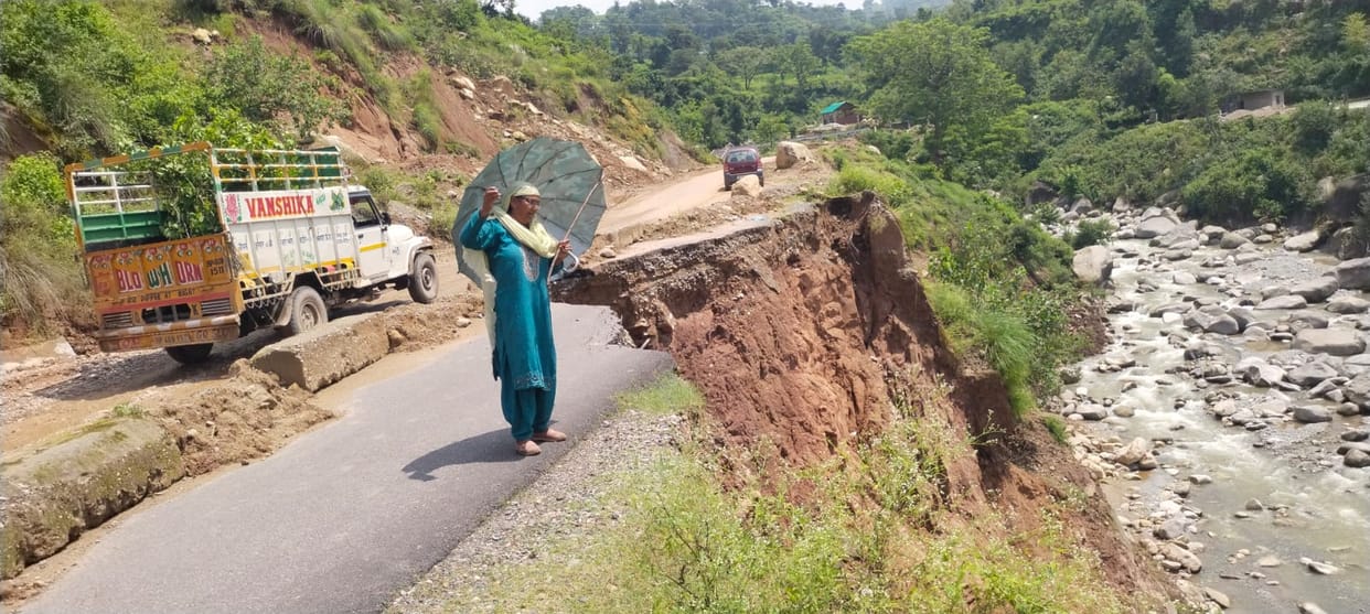 Collapsed section of the road poses a problem.