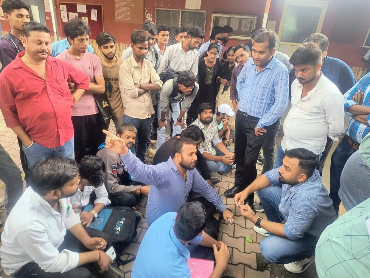 Sit-in protest at the university gate against issues faced by students.