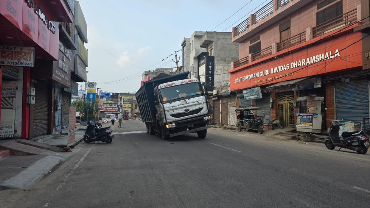 Overloaded vehicles passing through the city pose a risk of accidents.