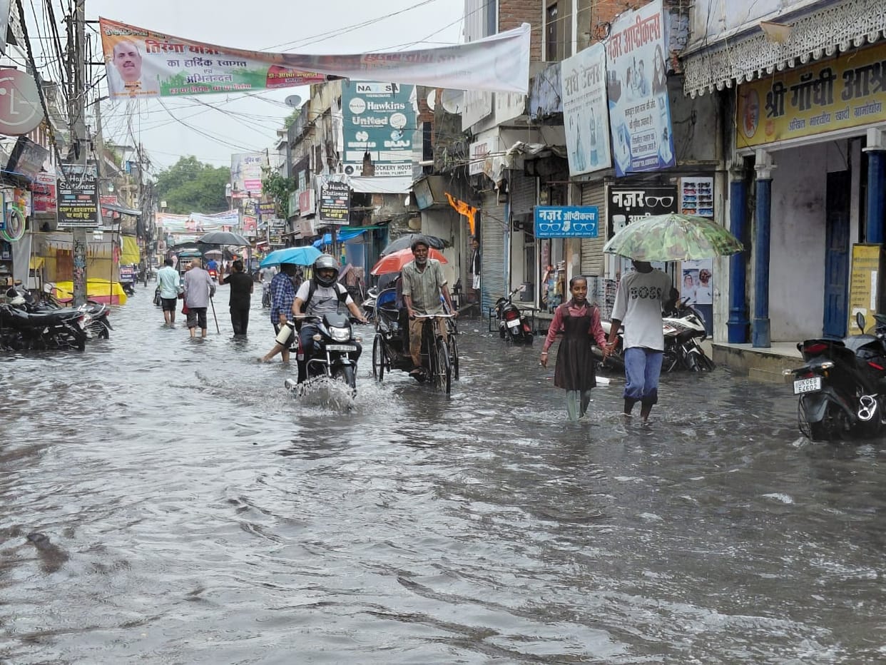 Three hours of rain left roads waterlogged; people grappled with the resulting chaos.