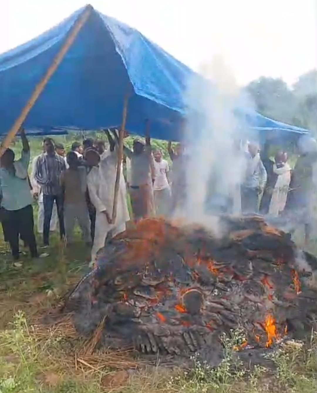 The funeral procession reached the cremation ground via a muddy path.