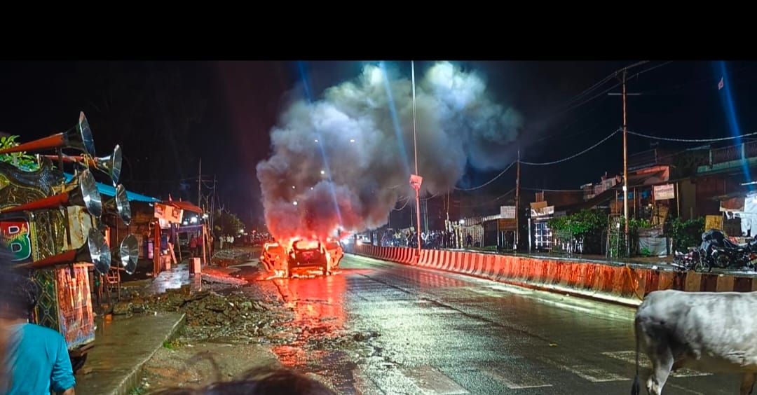 Car catches fire while moving on the highway.