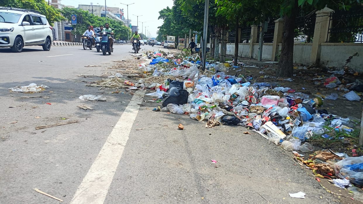 Sanitation system disrupted due to stalled door-to-door garbage collection; residents troubled by the stench, while shopkeepers say business is also being affected.