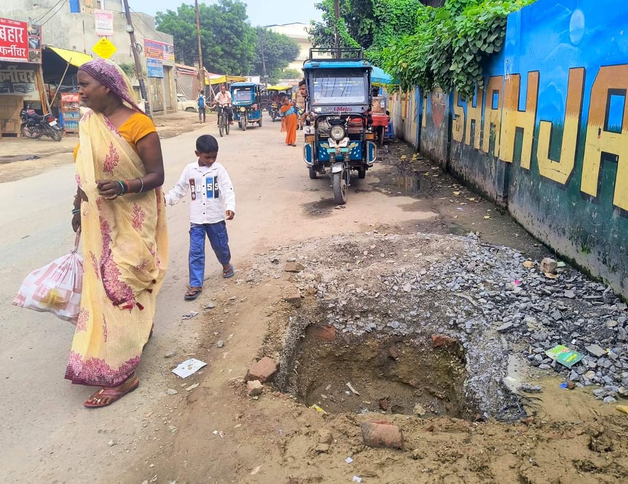 Deep potholes along the roadside... risk of accidents from open drains too.