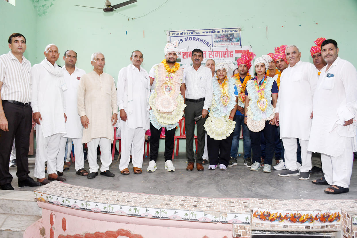 Coach Pradeep and players Sanjana and Tamanna felicitated