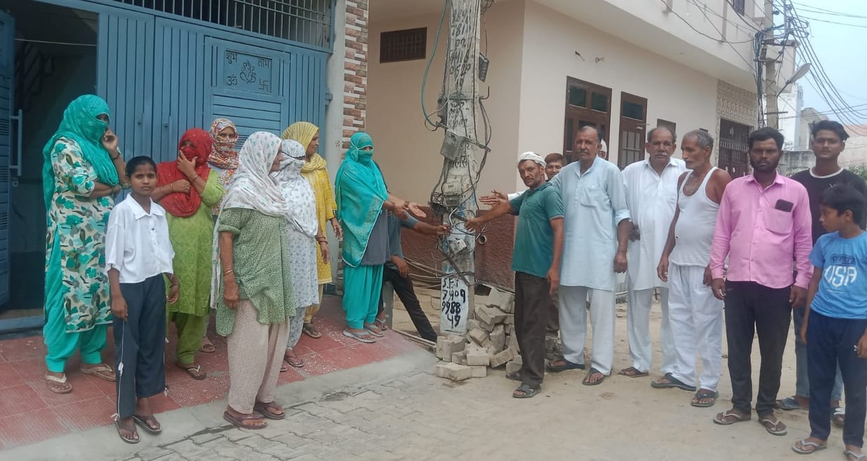 Residents of Khedi Sadh troubled by dangling wires and broken meter boxes on poles.