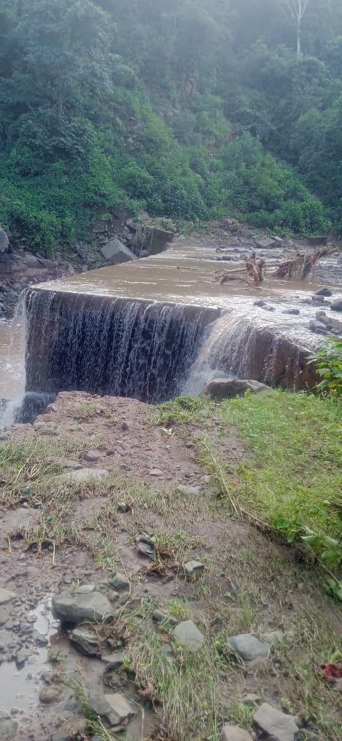 Road from Bangsu to Kharota damaged; water flowed over the bridge after the retaining wall subsided.