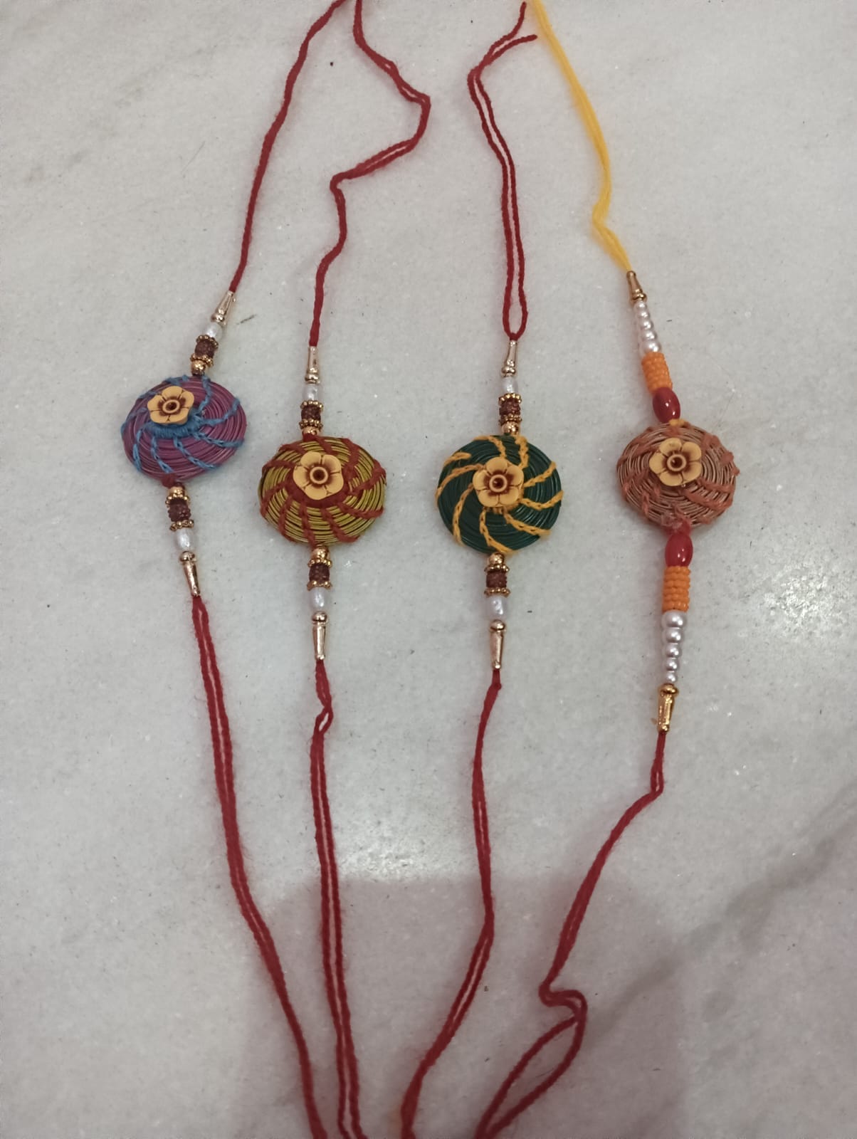 Conveying a message of environmental conservation by making Rakhis from pine needles.