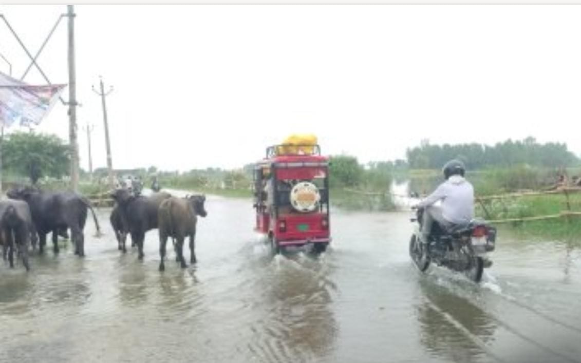 Floodwaters reached villages from the state highway.