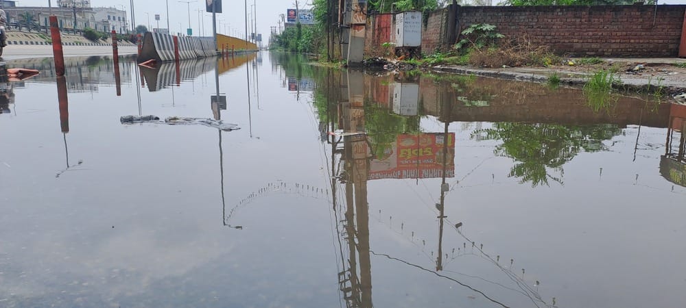 Water accumulated on the service lane after half an hour of rain.