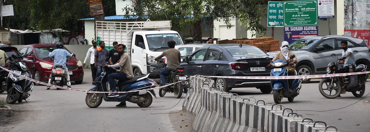 Road caves in at two locations in Indiranagar area; traffic disrupted.
