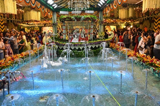 Radha-Krishna seated on a 60-foot swing; darshan of the 12 Jyotirlingas performed