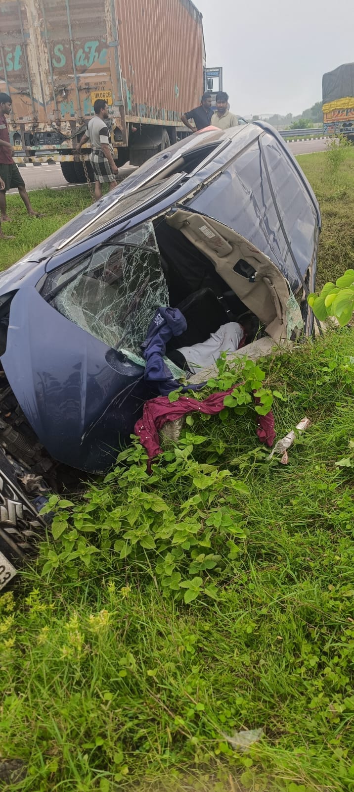 Car overturns after driver dozes off; driver dies, six injured.
