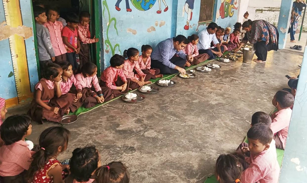 CDO checked the quality of the meal by eating with the children at the school
