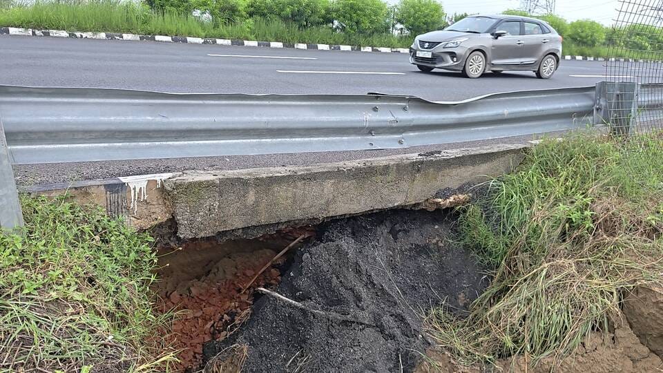 Expressway caves in due to rain; accidents occurring due to broken fencing.
