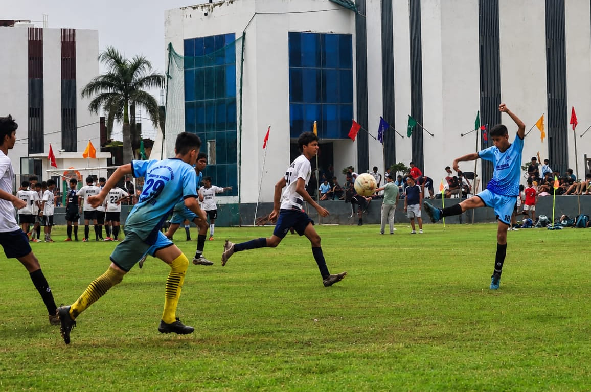The thrill of football takes center stage on the field amidst harsh weather conditions.