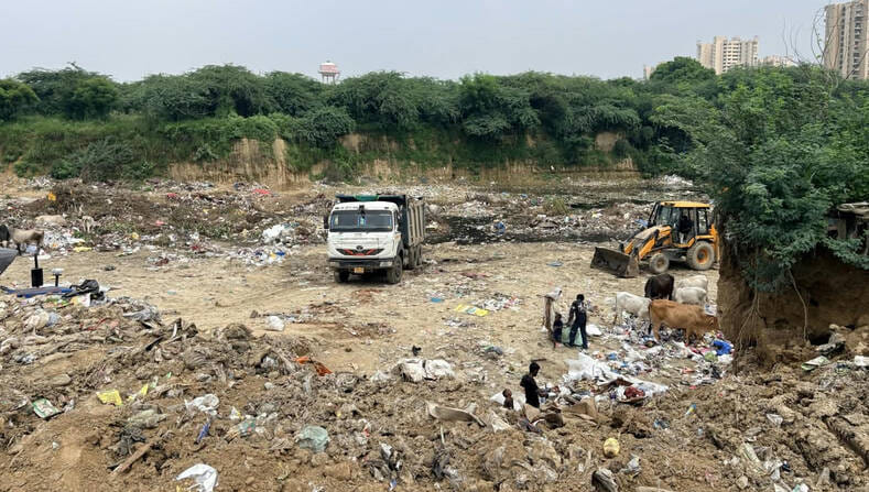 Waste from housing societies is being dumped in the green belt.