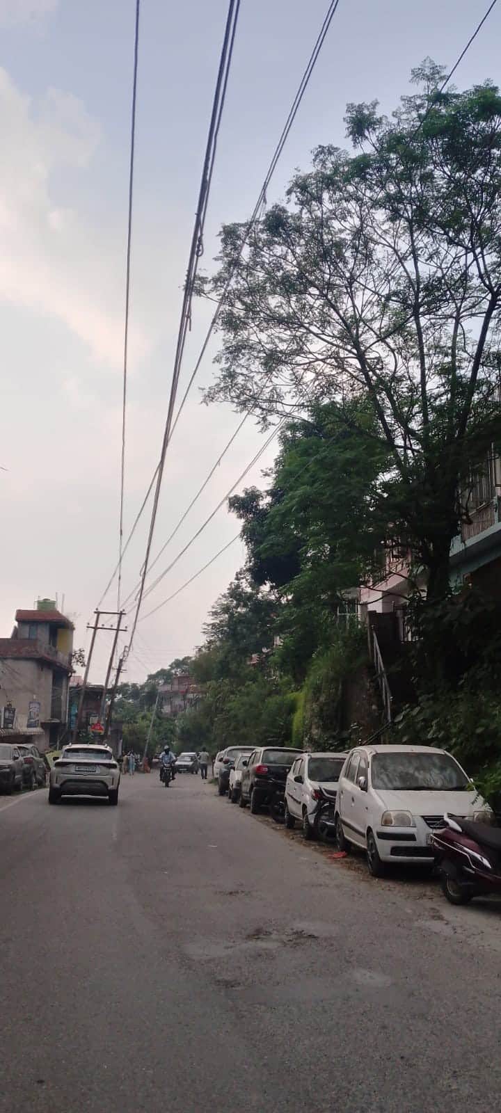 Power lines dangling dangerously over the highway.