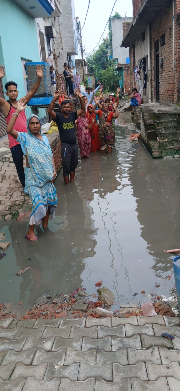 Water has been stagnant in the street for five days; children are unable to go to school