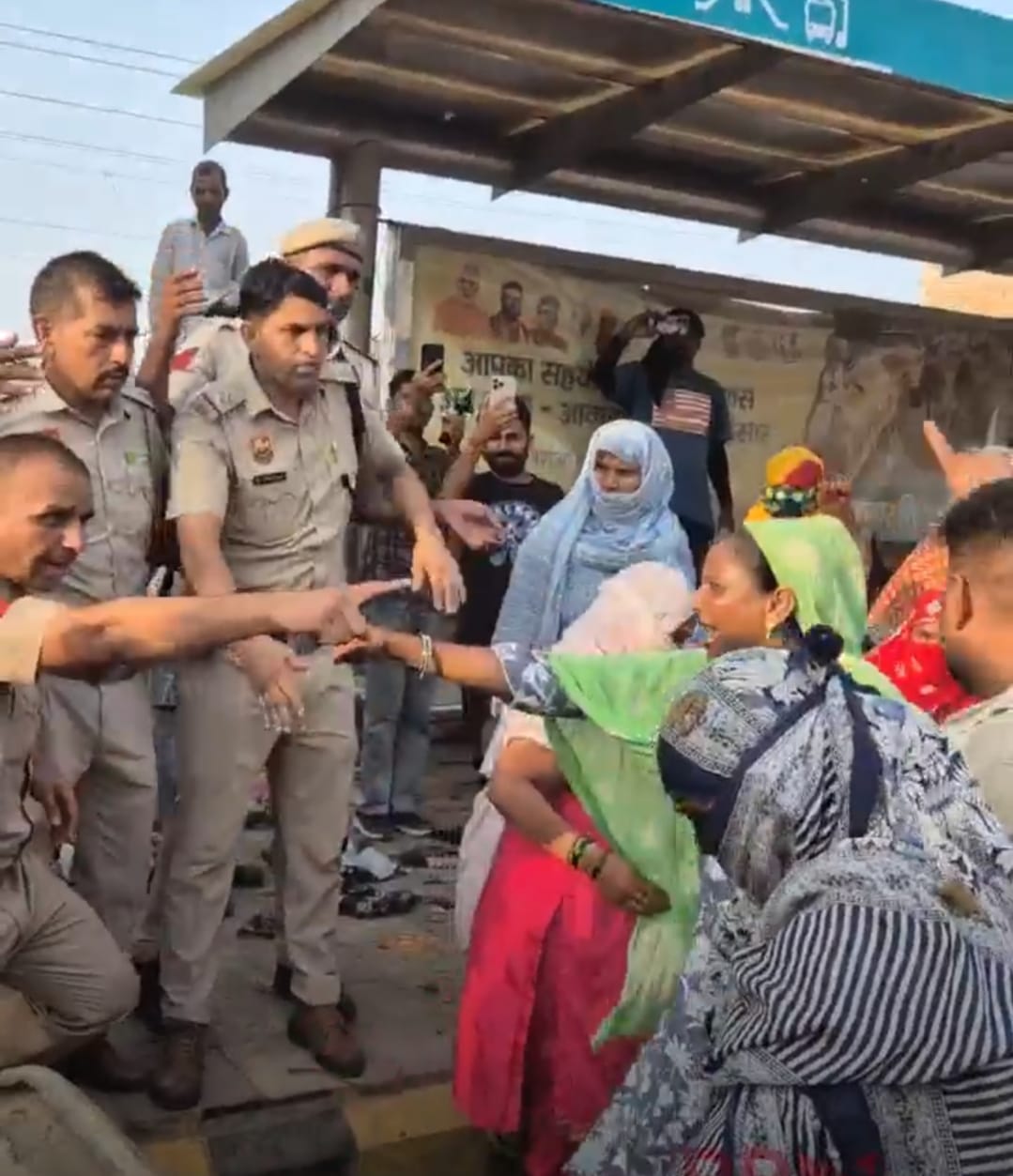 Garbage thrown at police; ruckus created after climbing onto a JCB.