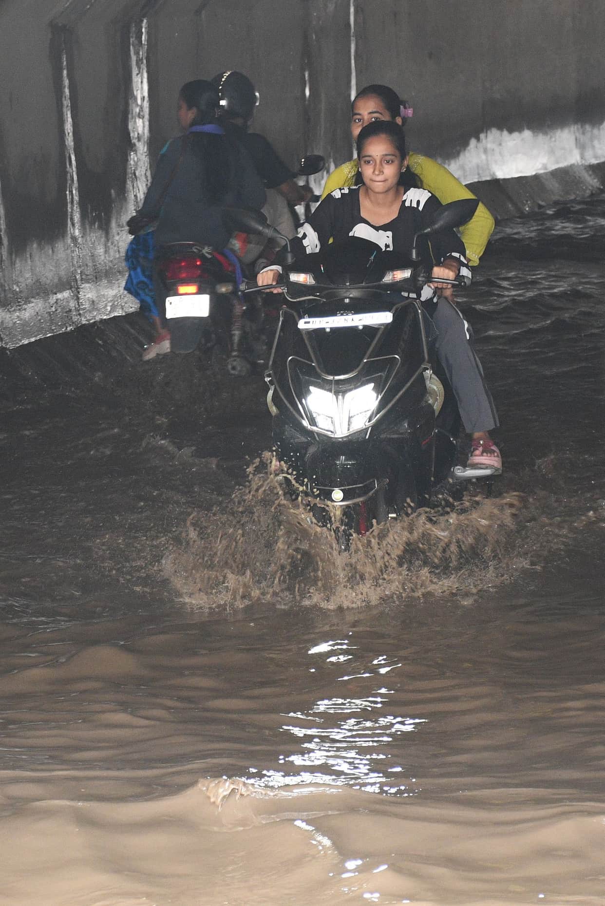 Rain amidst shifting clouds; waterlogging