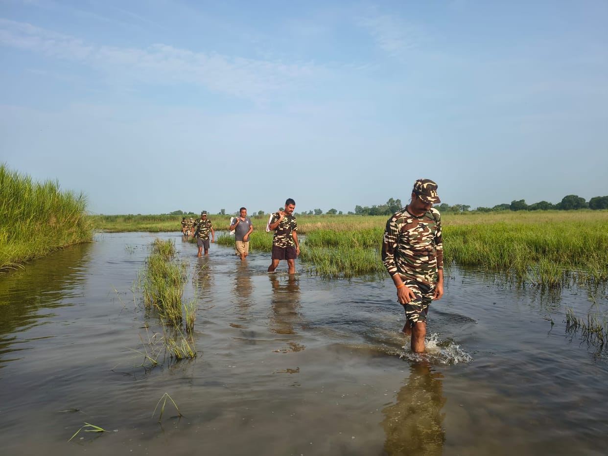 Treacherous routes brimming with water; soldiers stand guard at the Nepal border.