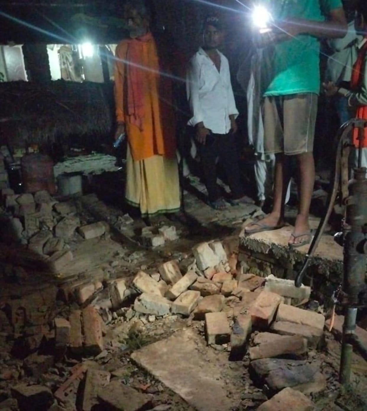 Elderly man dies after being buried under debris when a dilapidated wall collapses.