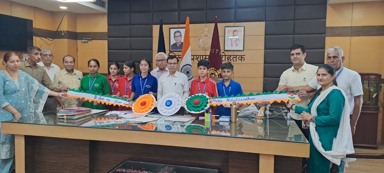Female students from the Model School in Meham tied Rakhis to officials.