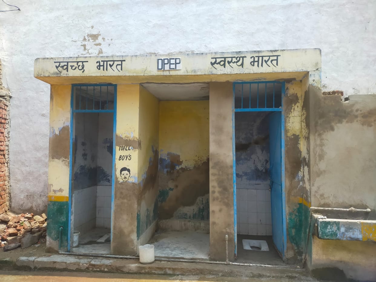 Relying on the toilet of a dilapidated *dharamshala* (pilgrims' rest house), a gas cylinder placed right next to the children's study bench, and meals being cooked in the same room where they study.