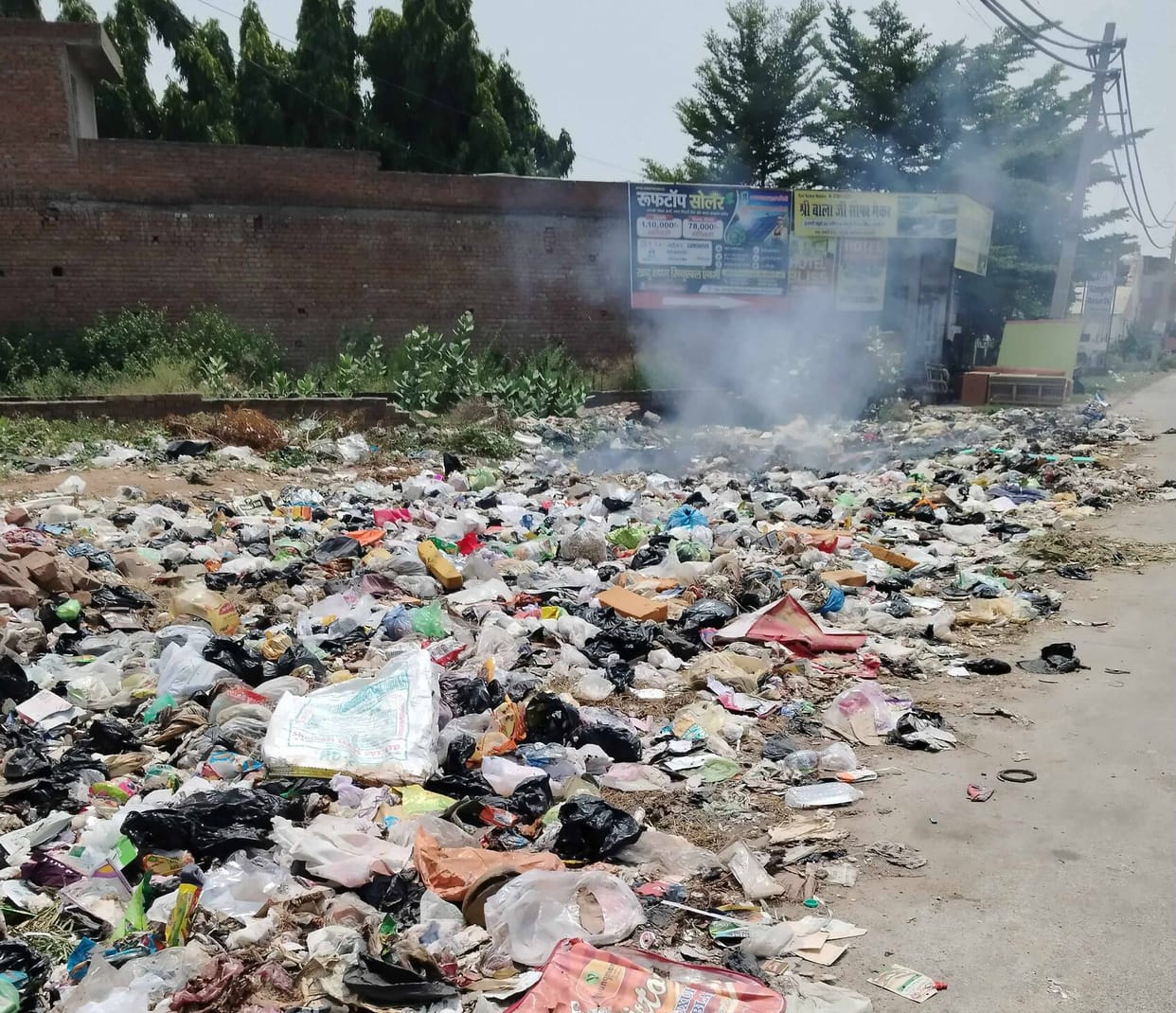 Anger: Residents fed up with filth dumped garbage on the road.