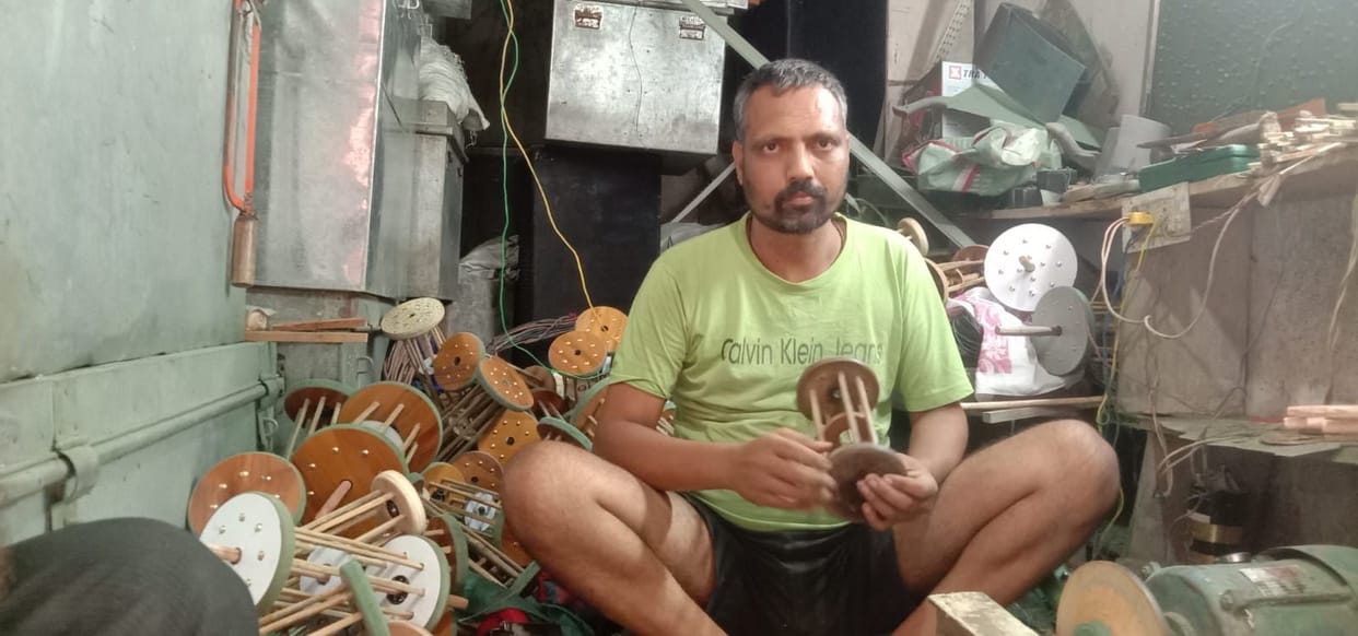 Rajesh has been crafting *charkhis* (kite-flying reels) by hand for 23 years, carrying forward a family legacy.