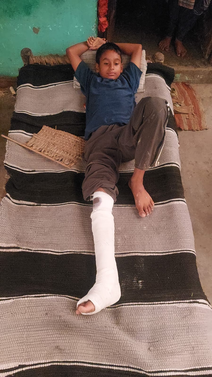 House wall collapses in the rain; two brothers injured after being trapped under the debris.