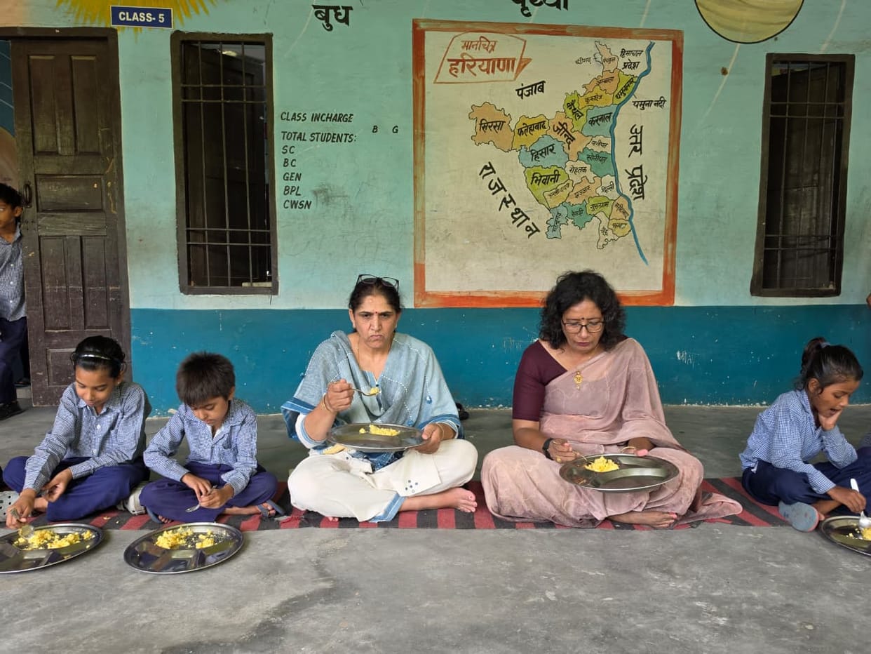 The District Education Officer inspected the mid-day meal and ate with the children.