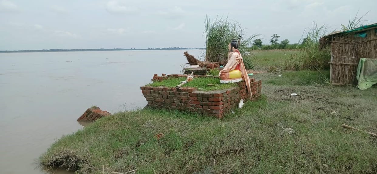 Statue of Siddha Baba on the verge of being lost to erosion; road continuously slipping into the Ganges.