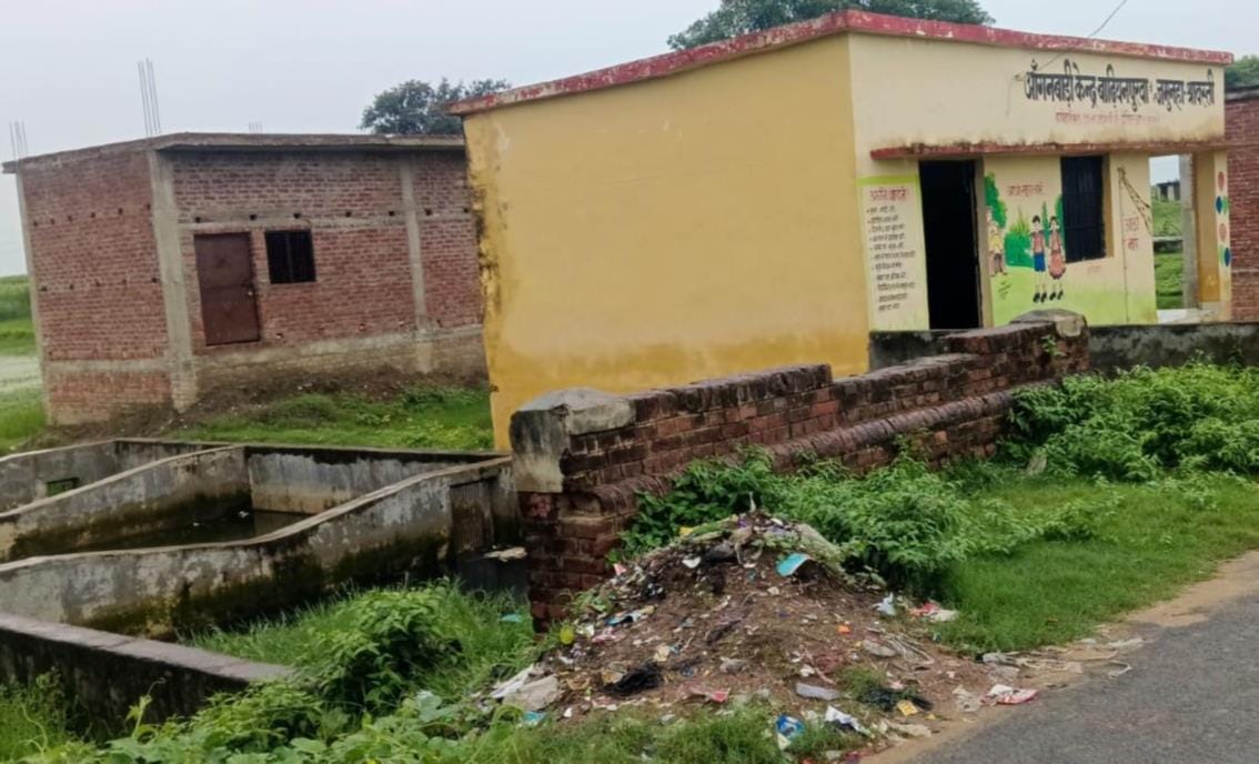 Filth abounds around the Anganwadi center; the toilet is in a dilapidated state.