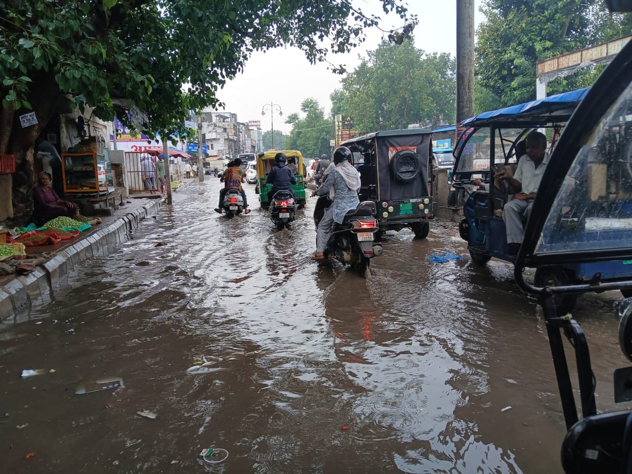 Afternoon rain brings relief from the heat, but waterlogging adds to the trouble.