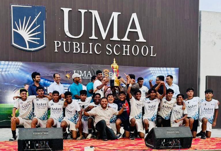Aster Public School wins trophy at CBSE Football Championship.