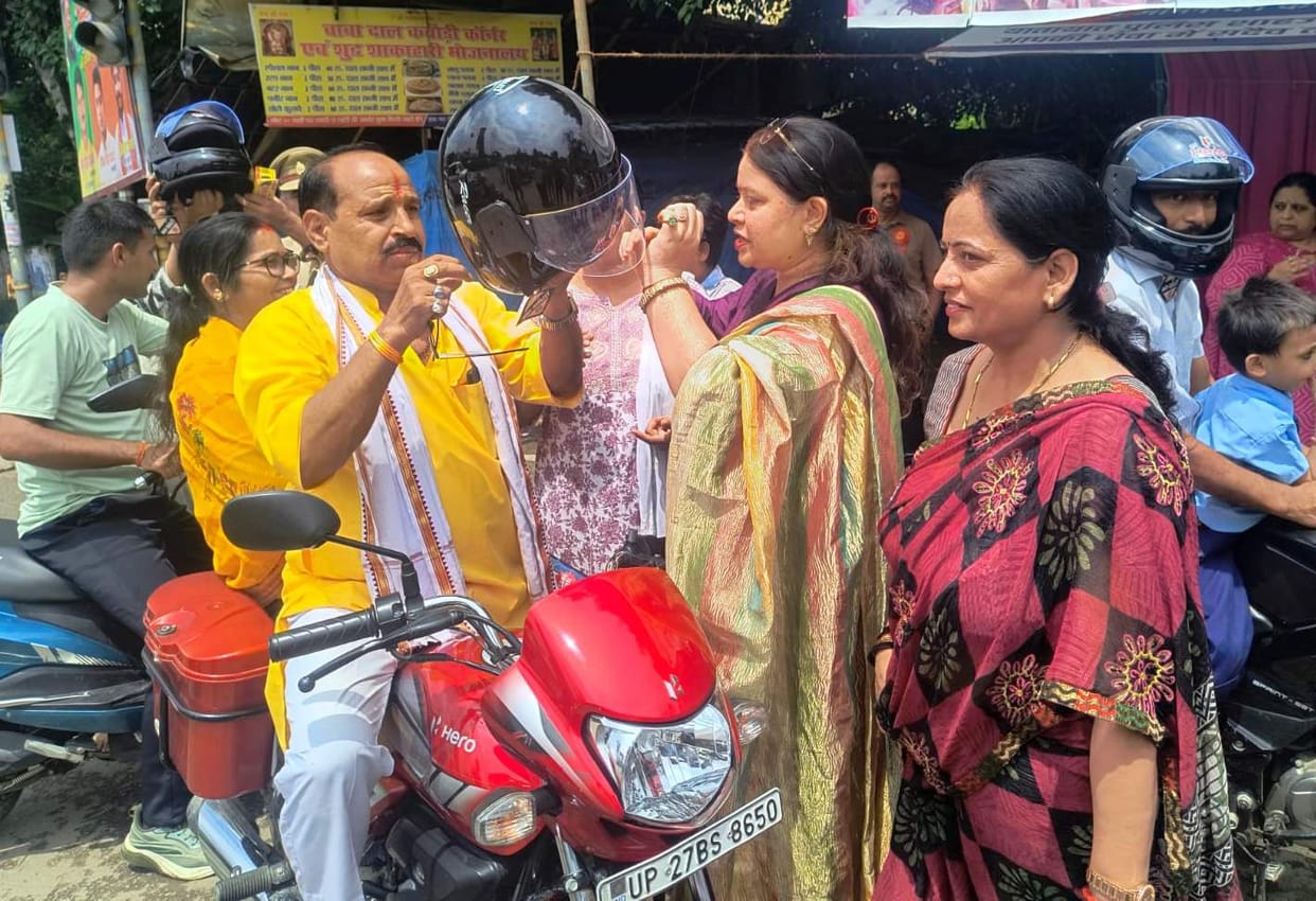 Helmets distributed to brothers ahead of Raksha Bandhan; safety pledge administered.