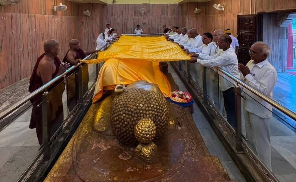 Devotees from Maharashtra offered robes to Lord Buddha.