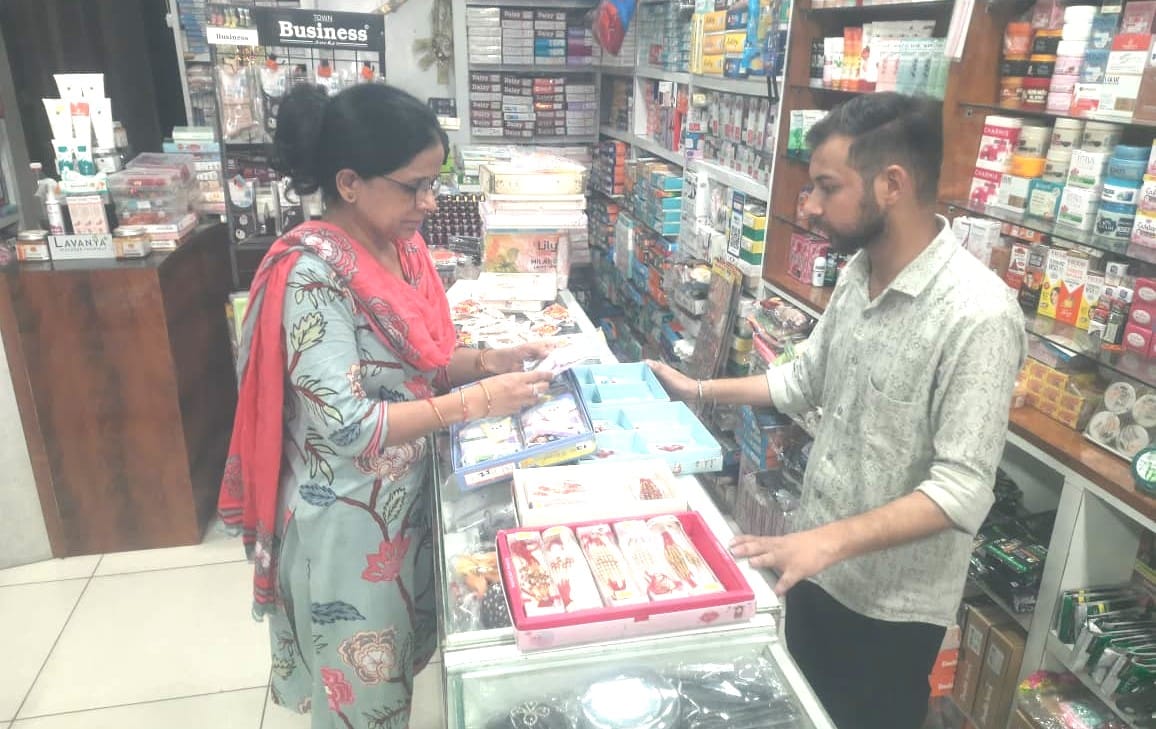 Gifts decked out for sisters; markets abuzz with crowds of brothers.