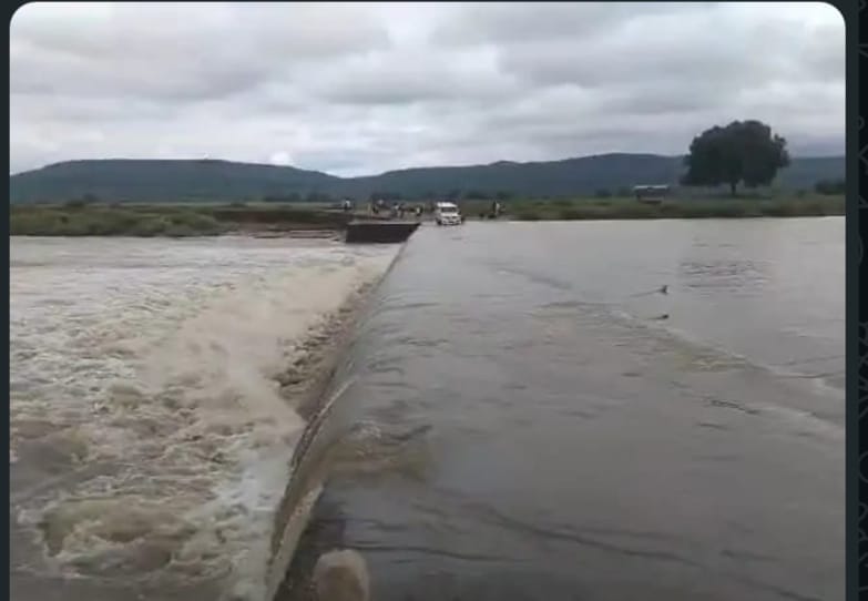 Water flows over Bardaha causeway; several villages cut off.