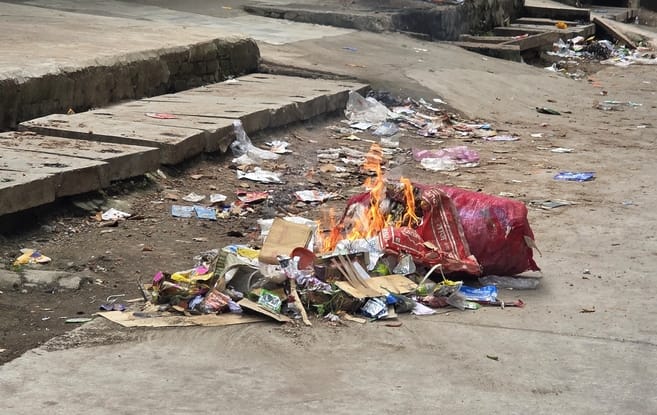 of garbage has piled up in the city; people have started burning the waste