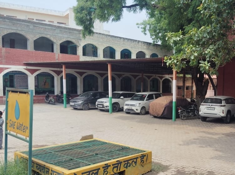 Shortage of space in schools due to unsafe classrooms; children studying in verandas.