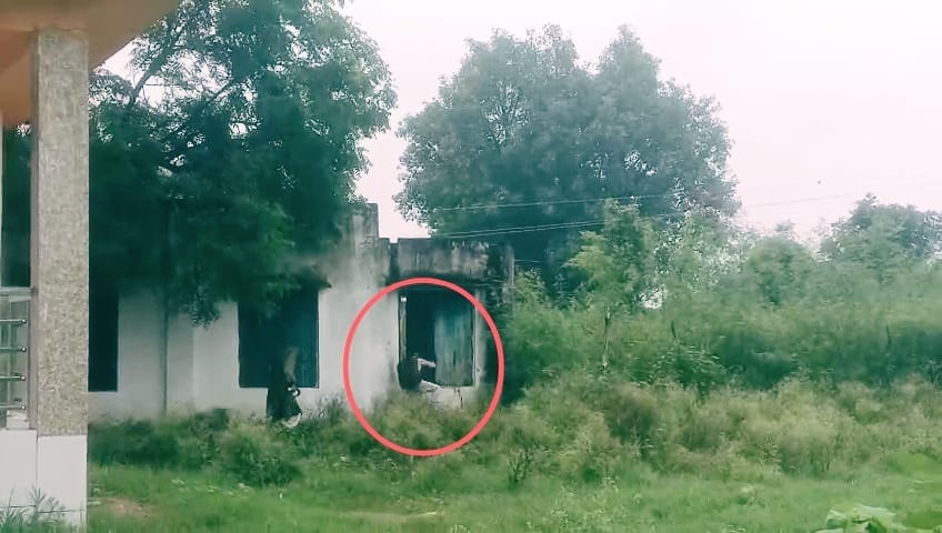 Pond water filled up to the school gate, children and teachers went through the broken window