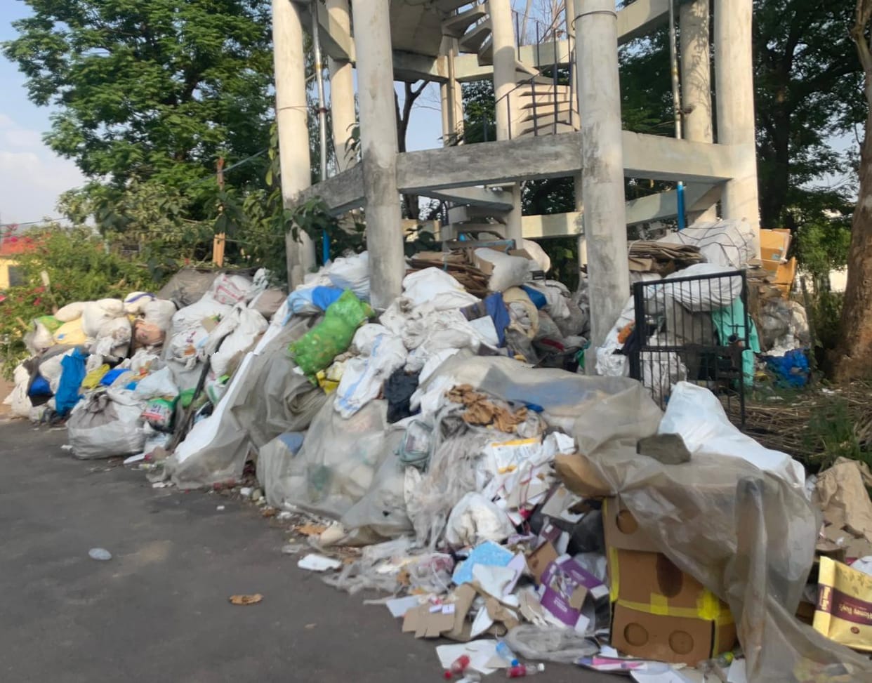 Piles of garbage at the main entrance of Ambedkar Ward; residents in distress.